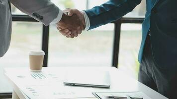 Business handshake for teamwork of business merger and acquisition,successful negotiate,hand shake,two businessman shake hand with partner to celebration partnership and business deal concept video