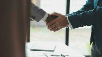 Business handshake for teamwork of business merger and acquisition,successful negotiate,hand shake,two businessman shake hand with partner to celebration partnership and business deal concept video
