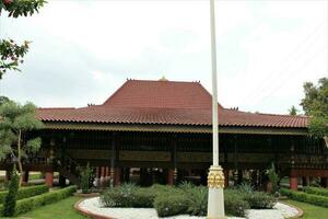 jakarta, indonesia-23 april 2023 monument taman mini indonesia indah anjungan sumatera selatan rumah limas photo