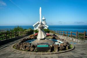 Udo, Jeju island, South Korea - Jun. 06, 2023. Beautiful Udo Lighthouse at Udobong peak, Udo mountain, beside Jeju do ,Jeju island. photo