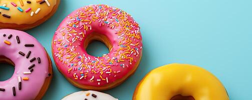 Assorted donuts on a pastel blue background, photo