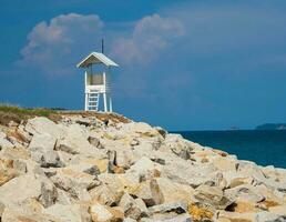 Landscape summer panorama tropical wooden lighthouse sea beach rock blue sky calm Nature ocean Beautiful wave crash splashing water travel Nang Ram Beach East thailand Chonburi Exotic horizon photo