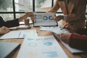 Team of business people are meeting to analyze data for marketing plan,Market research reports and income statistics, Financial and Accounting concept. photo