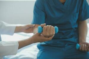 Physiotherapist working with patient in clinic photo