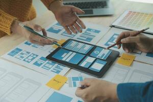 ux Graphic designer creative sketch planning application process development prototype wireframe for web mobile phone . User experience concept. photo