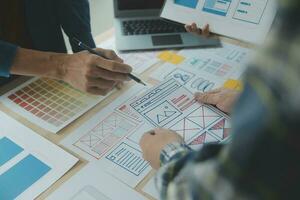 ux Graphic designer creative sketch planning application process development prototype wireframe for web mobile phone . User experience concept. photo