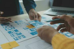 ux Graphic designer creative sketch planning application process development prototype wireframe for web mobile phone . User experience concept. photo