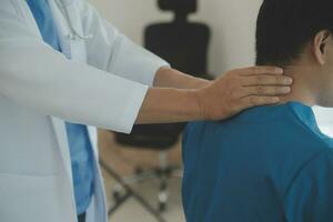 Physiotherapist working with patient in clinic, closeup photo