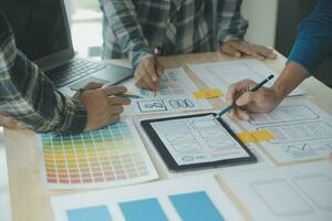 ux Graphic designer creative sketch planning application process development prototype wireframe for web mobile phone . User experience concept. photo