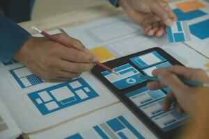 ux Graphic designer creative sketch planning application process development prototype wireframe for web mobile phone . User experience concept. photo
