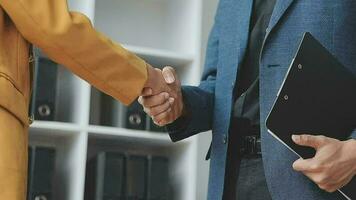 Business handshake for teamwork of business merger and acquisition,successful negotiate,hand shake,two businessman shake hand with partner to celebration partnership and business deal concept video