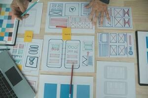 ux Graphic designer creative sketch planning application process development prototype wireframe for web mobile phone . User experience concept. photo
