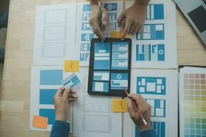 ux Graphic designer creative sketch planning application process development prototype wireframe for web mobile phone . User experience concept. photo