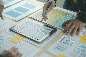ux Graphic designer creative sketch planning application process development prototype wireframe for web mobile phone . User experience concept. photo