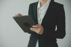 Beautiful female call center operator working on computer in office photo