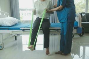 Physiotherapist working with patient in clinic, closeup photo