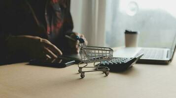 Online payment,businessman hands holding credit card and using laptop for online shopping. Cyber Monday Concept photo