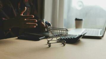 Online payment,businessman hands holding credit card and using laptop for online shopping. Cyber Monday Concept photo