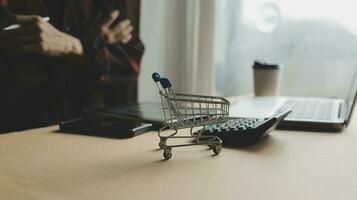 Online payment,businessman hands holding credit card and using laptop for online shopping. Cyber Monday Concept photo