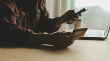 Online payment,businessman hands holding credit card and using laptop for online shopping. Cyber Monday Concept photo