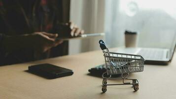 Online payment,businessman hands holding credit card and using laptop for online shopping. Cyber Monday Concept photo