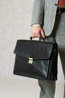 A business keeps his bag. Closeup photo