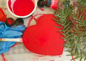 A red painted paper box in the form of a heart photo