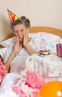 Old woman celebrates her birthday photo