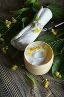 Face cream with linden blossoms. photo