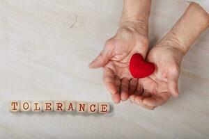 Word TOLERANCE composed of wooden dices photo