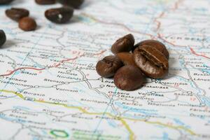 Coffee beans on a map. Closeup photo