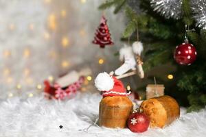 Traditional Italian cake- panettone in Santa Claus hat. photo