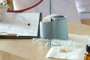 Medical tools,lab analysis,pen,results,medication on a doctors table,, Medication for injection on a doctors table photo