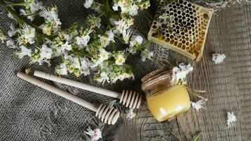 Chestnut honey on a wooden surface. photo