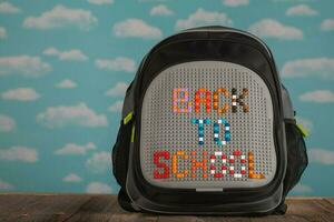 School backpack on a wooden surface. photo