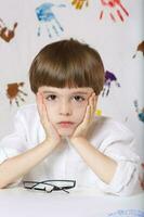 Boy of seven years old with books. Back to school photo