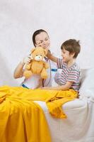 A child and a paediatrician in her cabinet photo