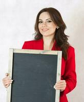 Young woman with a black chalk board photo