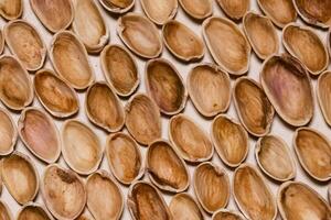 Pistachios shells on a flat surface. Background photo