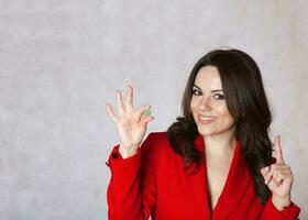 One euro coin in the hand of a young woman. photo