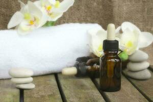 Dropper bottles pure orchid essential oil. Closeup photo