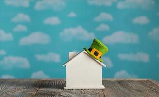 Small wooden house with leprechaun's hat on it. photo