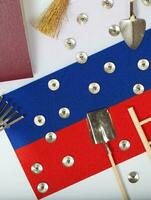 Agricultural tools on a Russian flag photo