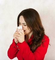 Acrying young woman dressed in a formal way. photo