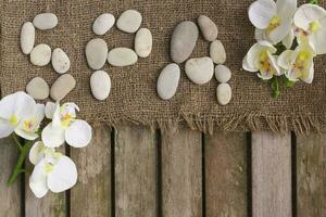 The word spa done with river pebbles. Background photo