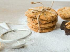 Five biscuits with wallnuts and chocolate chips photo