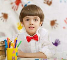 A boy of seven years is smiling photo