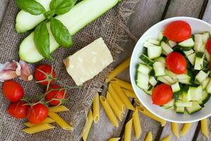 Ingredients for preparing Italian pasta dish. Top view photo