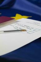 Black pen on an EU Referendum ballot paper. Passport in the background. photo