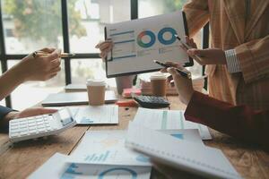 Team of business people are meeting to analyze data for marketing plan,Market research reports and income statistics, Financial and Accounting concept. photo